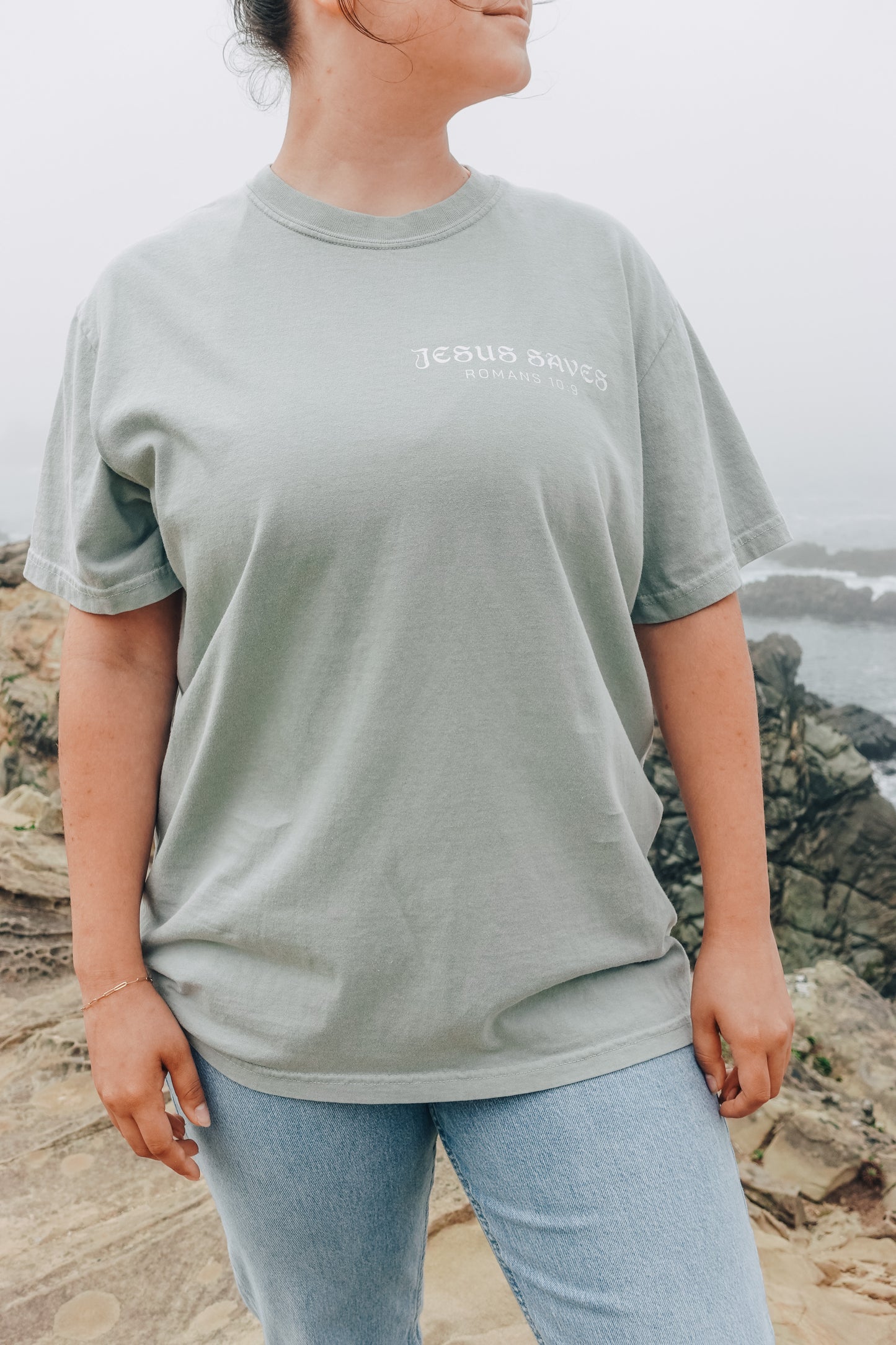 Faith-based aesthetic t-shirt featuring Romans 10:9