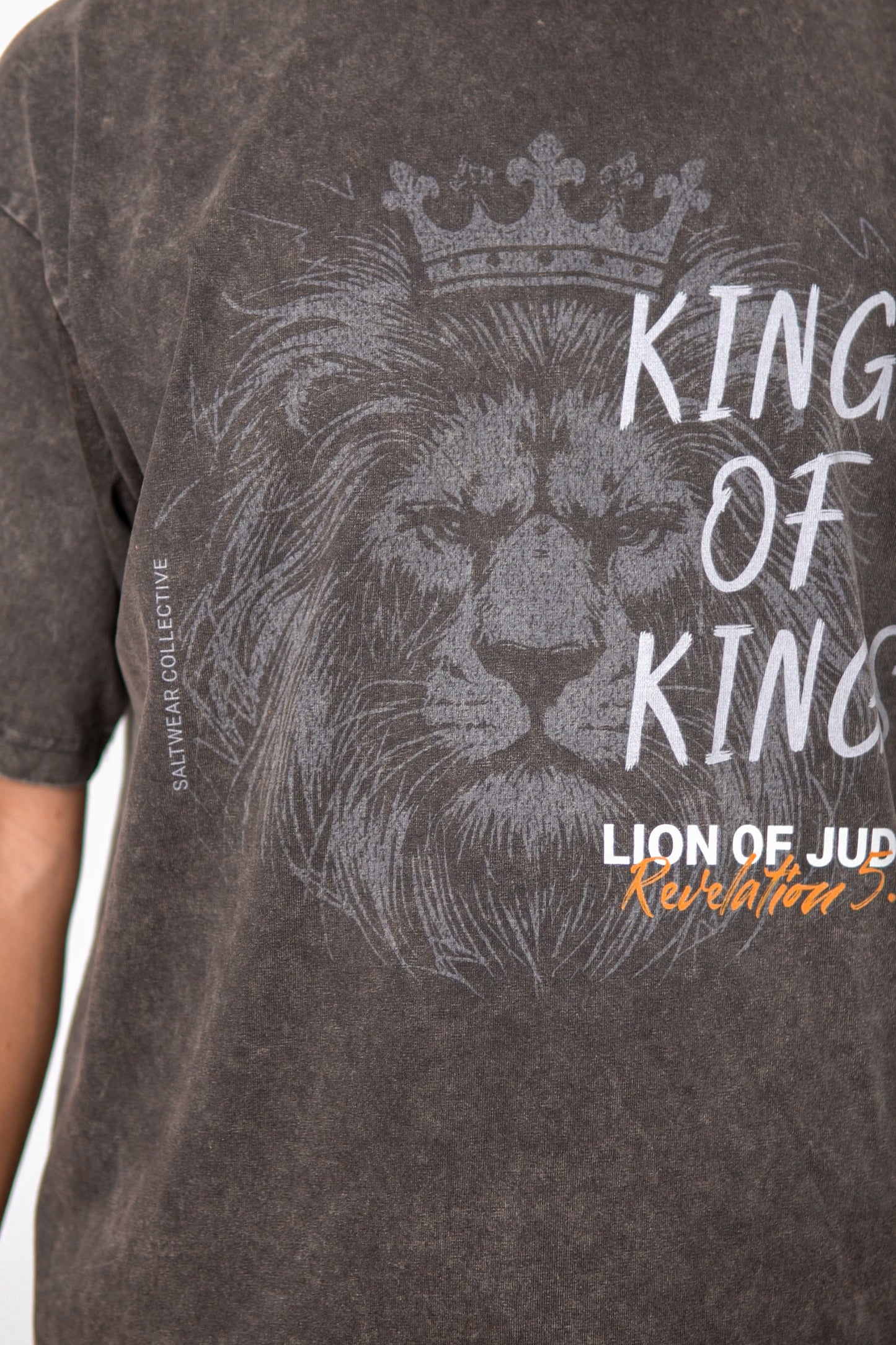 Close-up of Lion of Judah graphic on acid wash tee