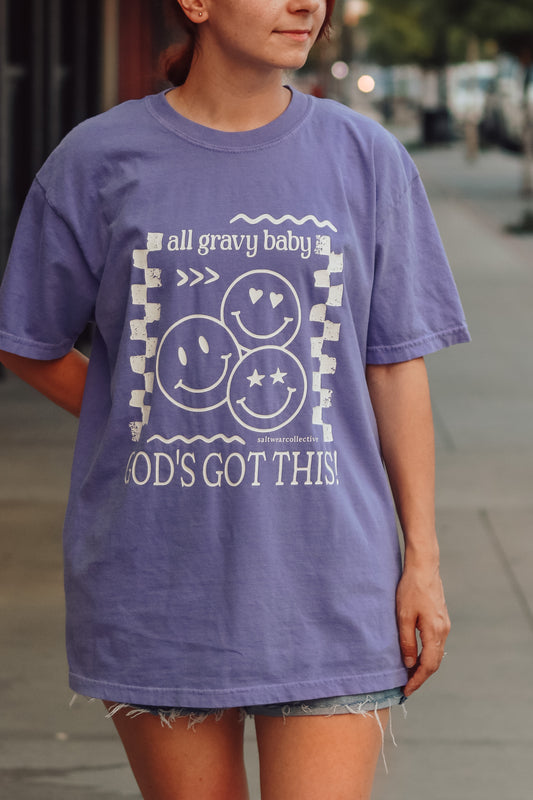 Model wearing God's Got This retro-inspired faith t-shirt in violet