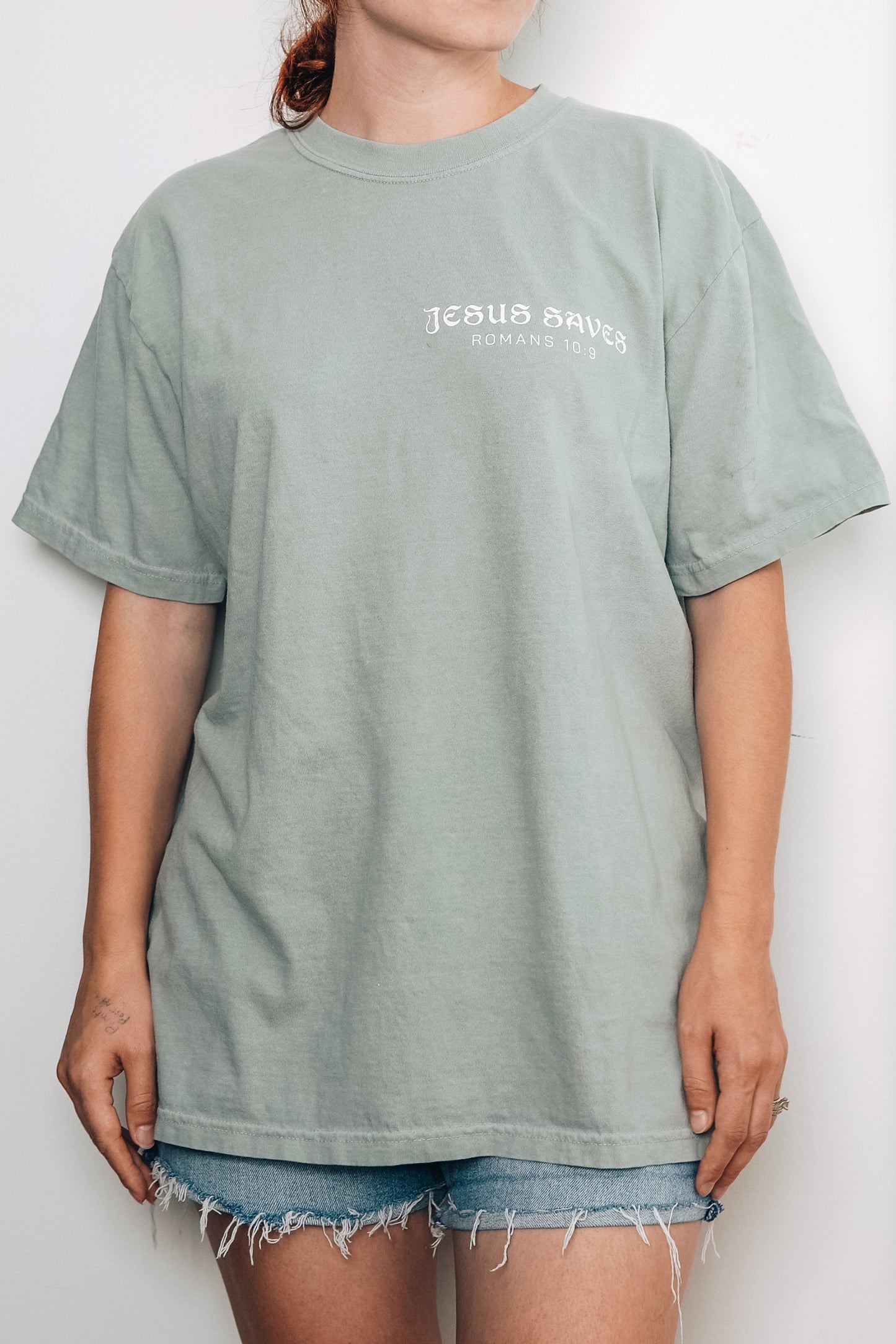 Person wearing Jesus Saves Aesthetic T-Shirt by Saltwear Collective,  