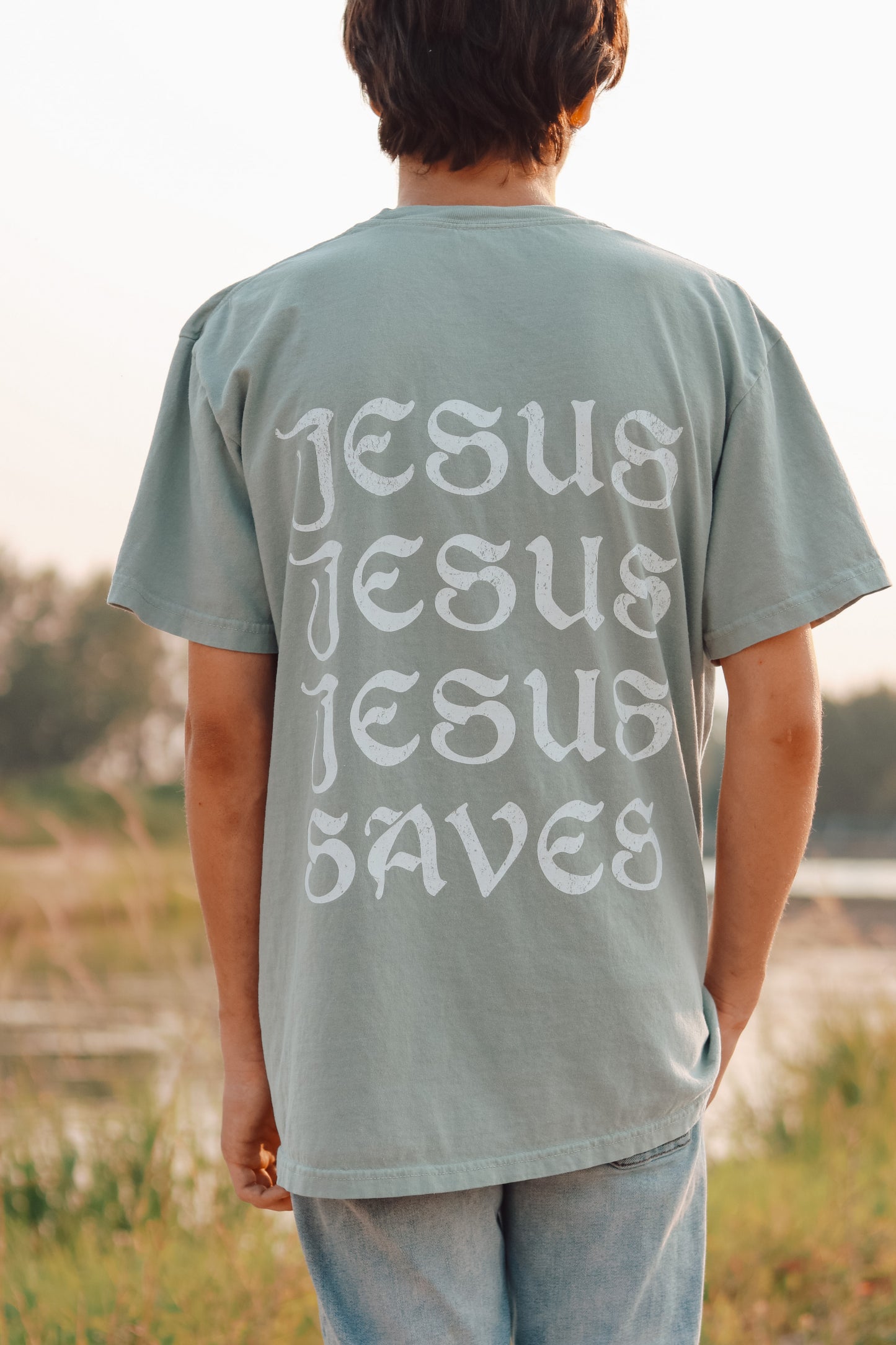 Faith-based aesthetic t-shirt featuring Romans 10:9