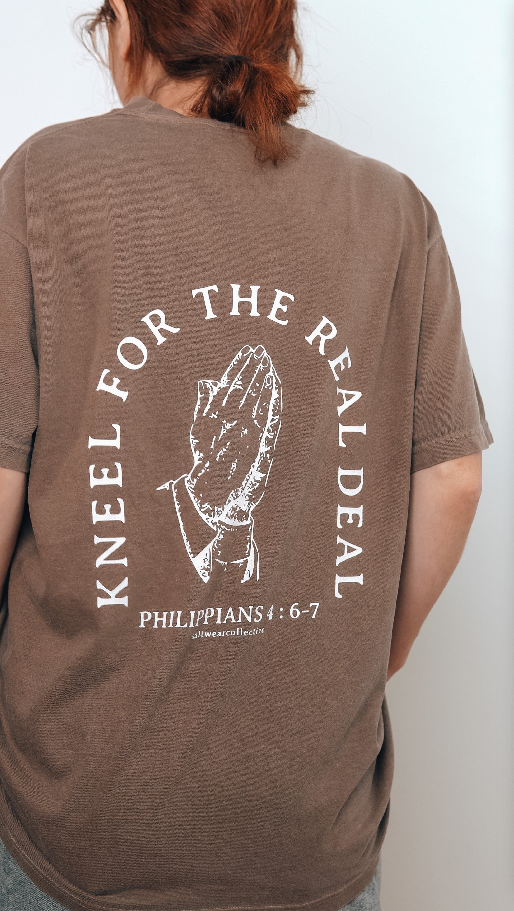 Faith-inspired t-shirt with praying hands design