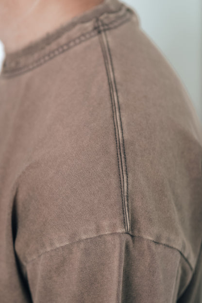 Close-up of the stitching detail on the Let Go & Let God t-shirt collar