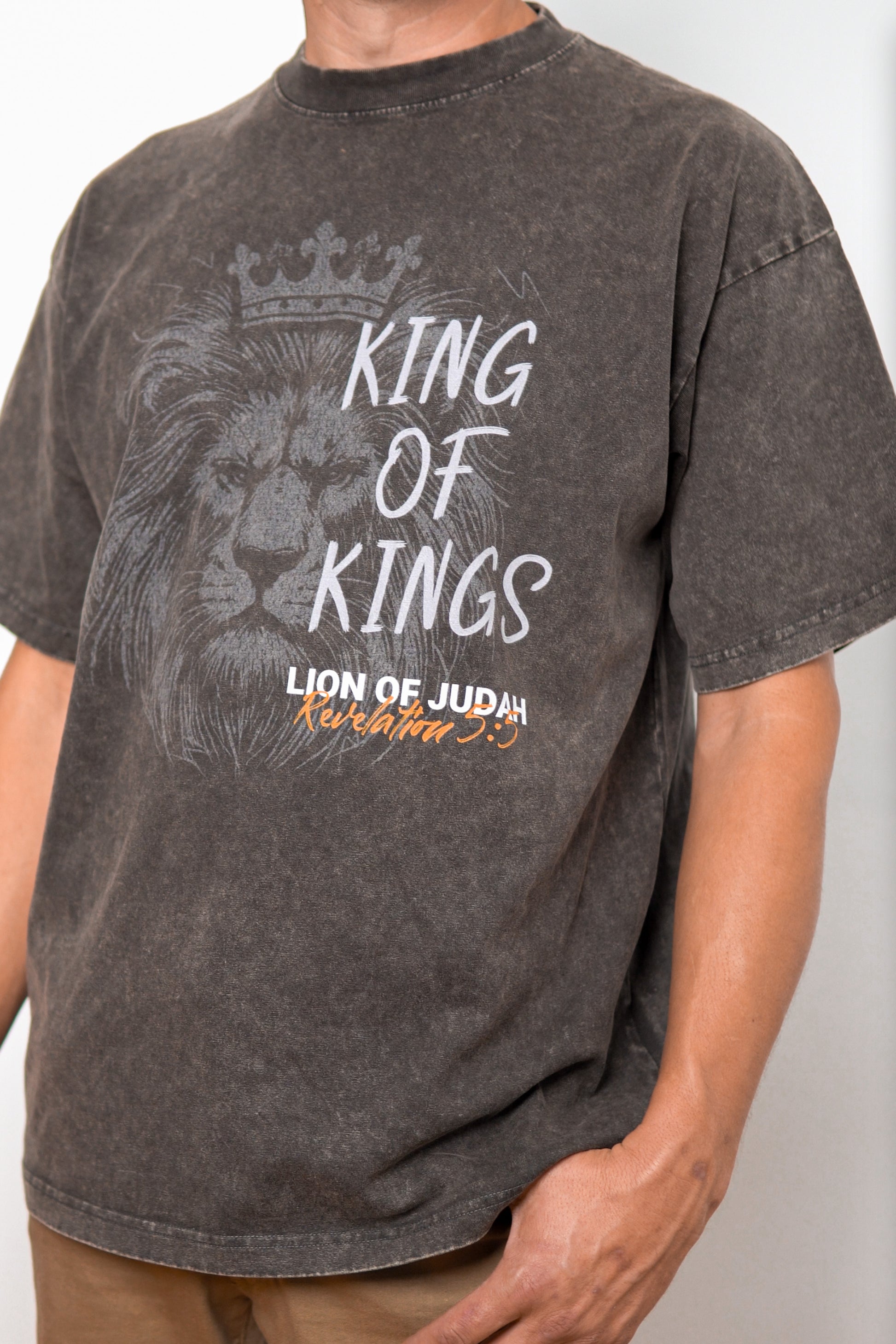 Close-up of Lion of Judah graphic on acid wash tee