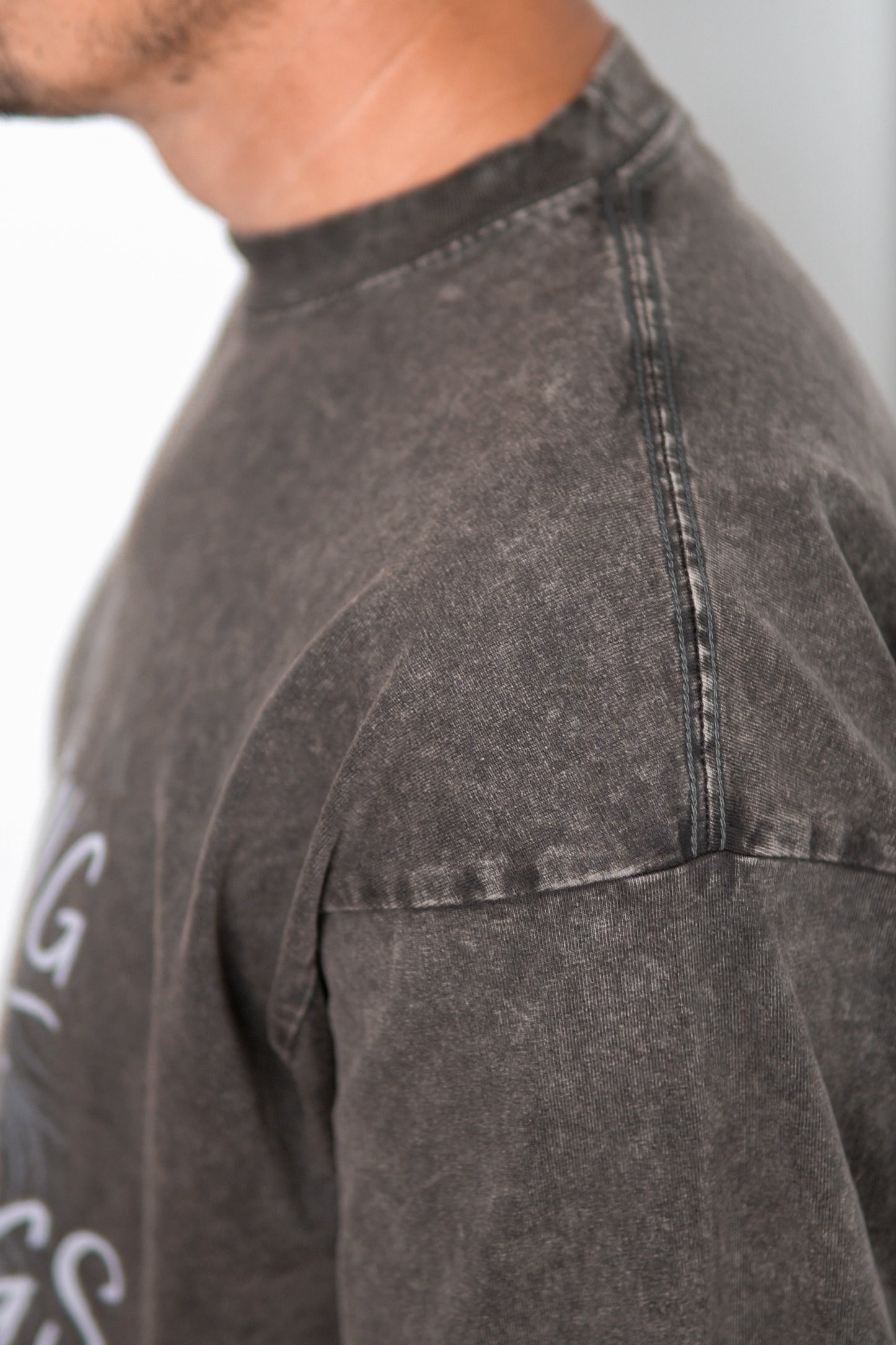 Close-up of Lion of Judah graphic on acid wash tee