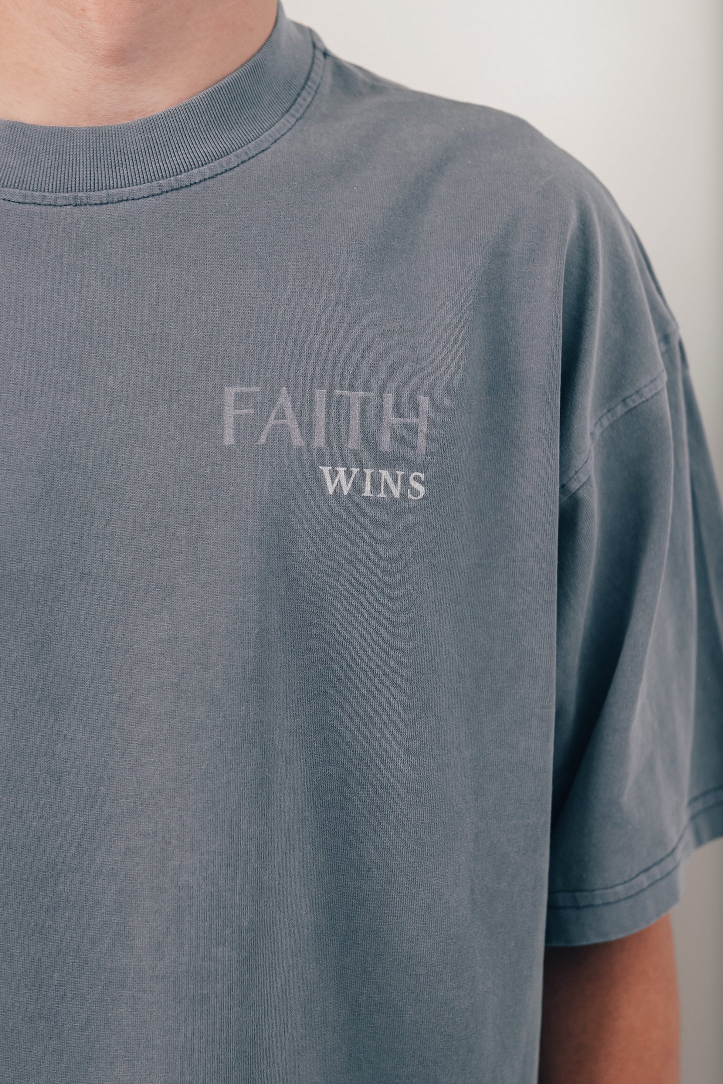 Faith Wins Over Fear t-shirt back with 'Over Fear' and Isaiah 41:10