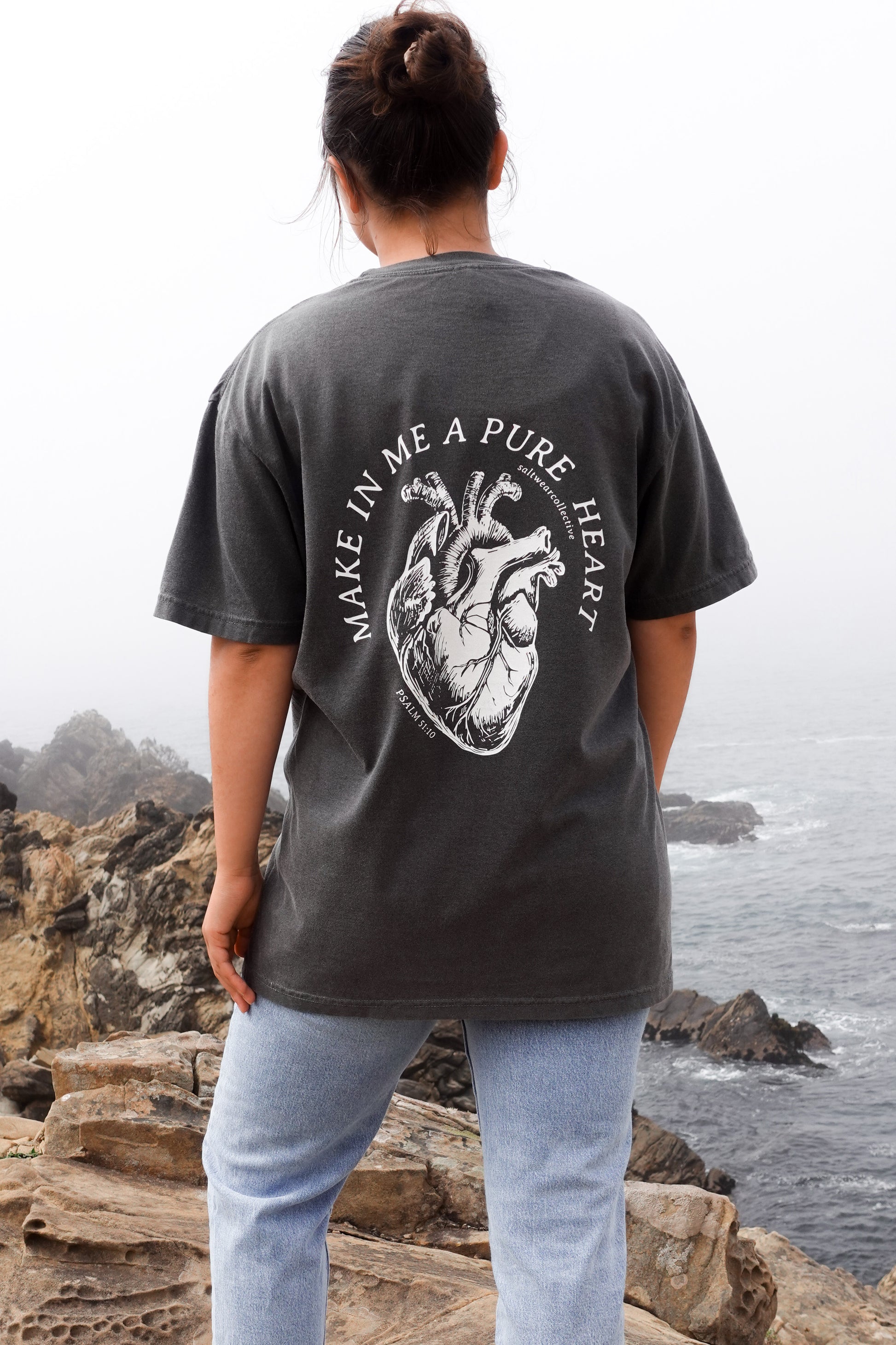 Person wearing Make Me a Pure Heart T-Shirt with anatomical heart graphic and Psalm 51:10