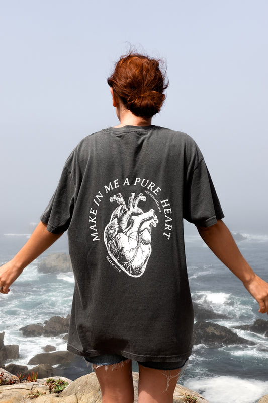 Person wearing Make Me a Pure Heart T-Shirt with anatomical heart graphic and Psalm 51:10
