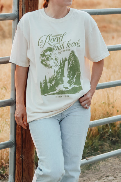 Christian tee with mountain and faith message graphic