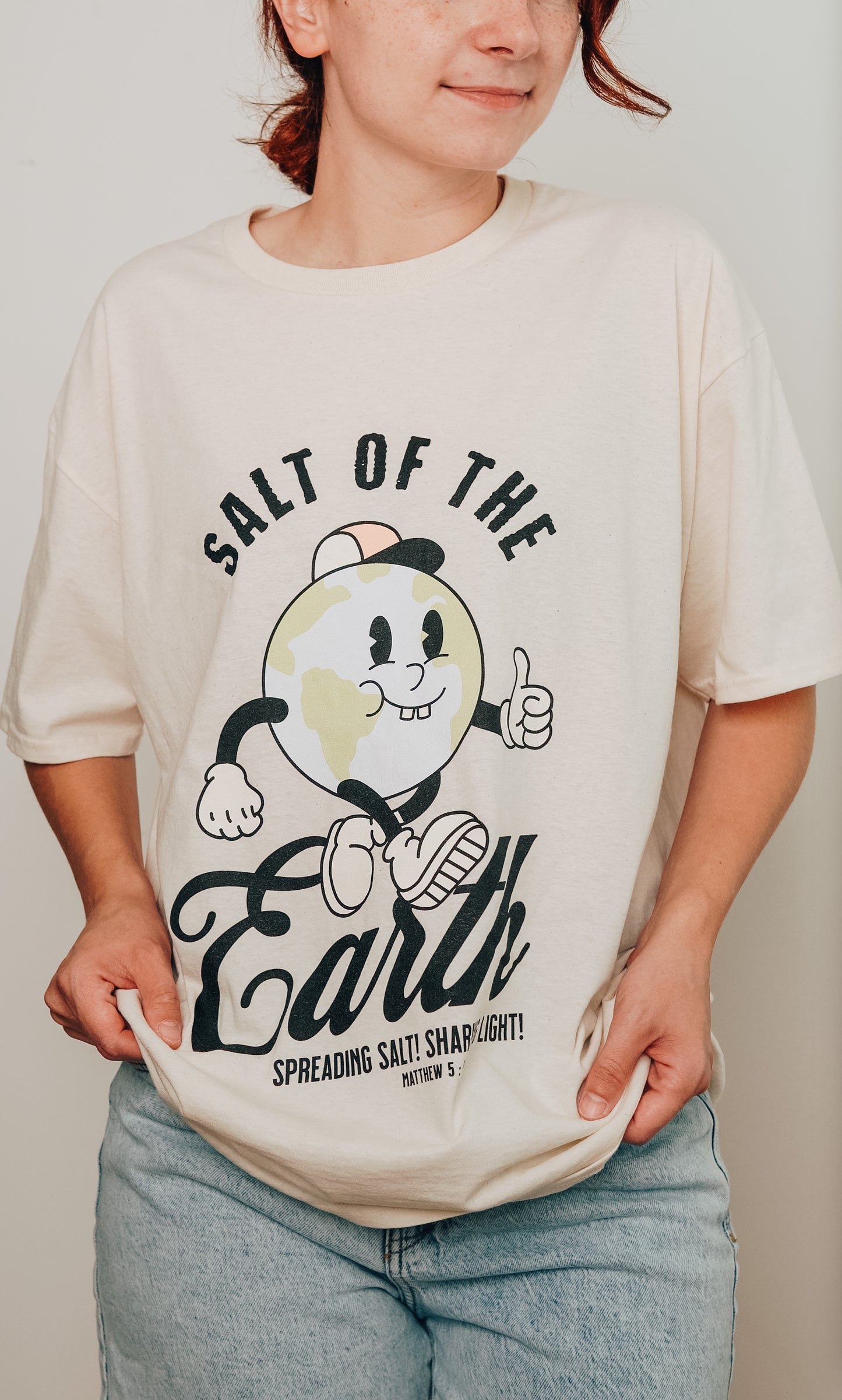 Model wearing Salt of the Earth vintage Christian t-shirt