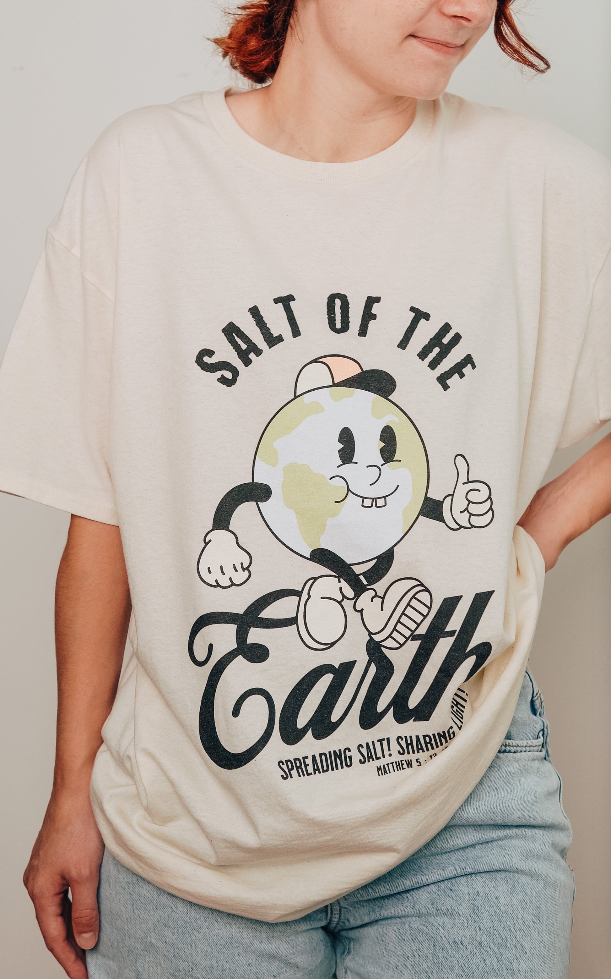 Model wearing Salt of the Earth vintage Christian t-shirt